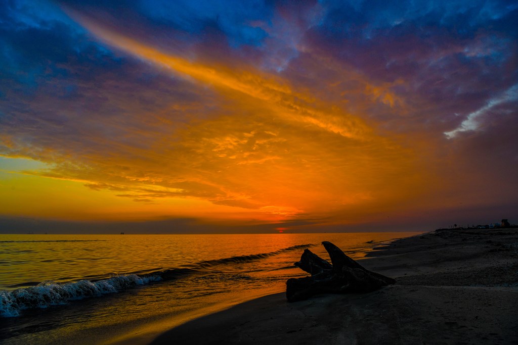 Sunset over the Gulf of Mexico at Rutherford Beach, Louisiana.